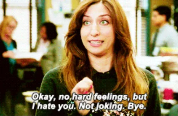 Woman with a sarcastic expression and funny caption in an office setting.