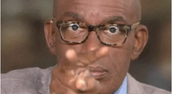 Man wearing glasses pointing directly at the camera