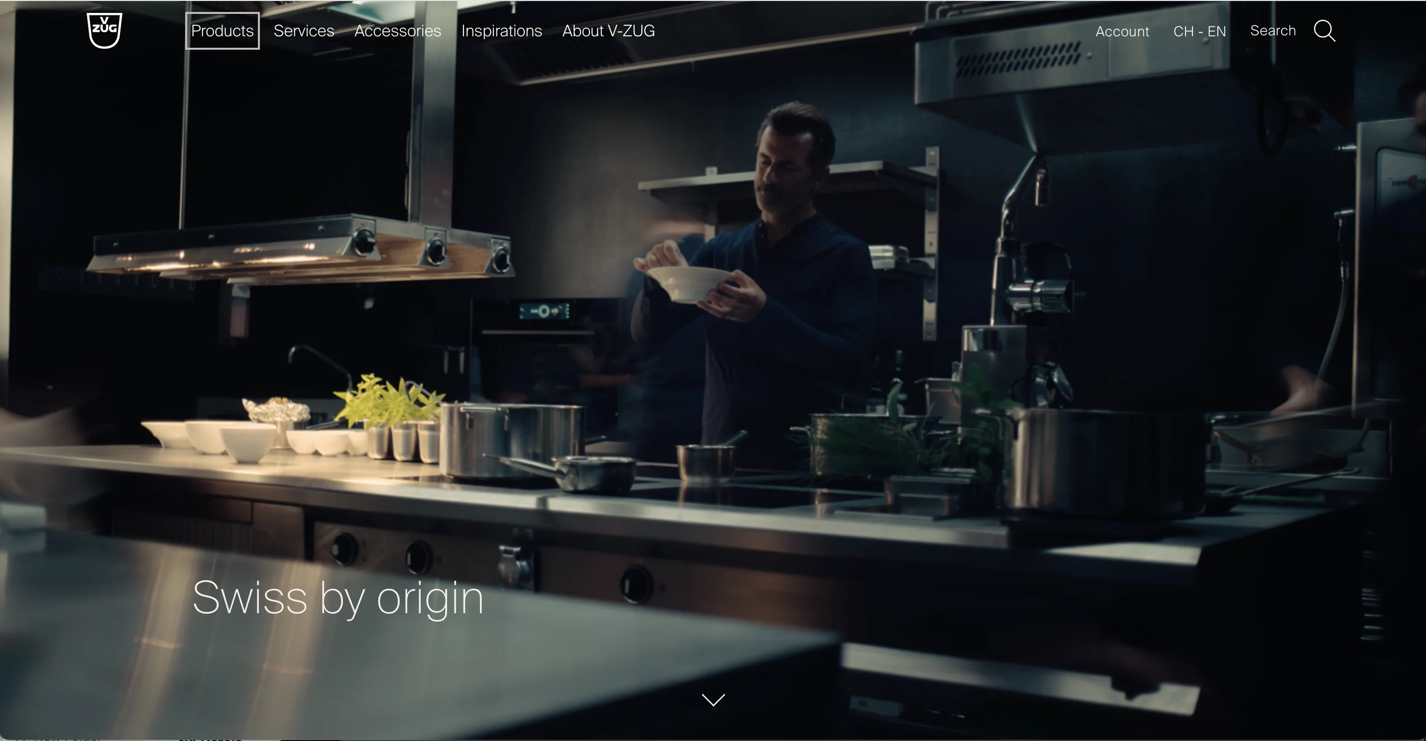 Chef cooking in a modern kitchen with Swiss branding visible