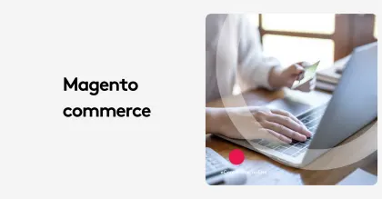 Person holding credit card using laptop for Magento commerce.
