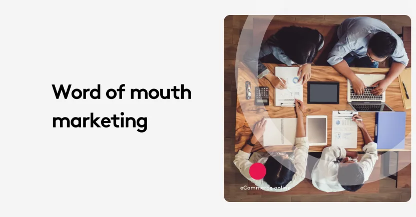 Top view of a team meeting with laptops and documents on word of mouth marketing.