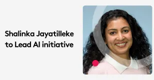 Woman smiling, announced to lead AI initiative.