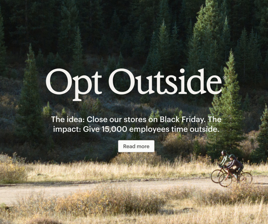 REI Opt Outside campaign image with cyclists riding through a forest