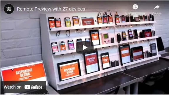 Multiple devices showcasing responsive design testing on shelves.
