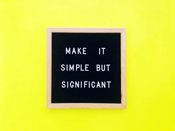 Letter board with quote 'Make it simple but significant' on yellow background.