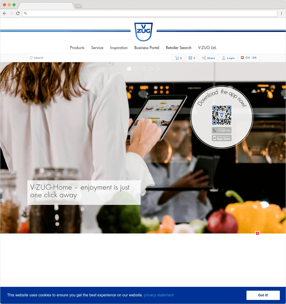 Person using a tablet in a kitchen setting with QR code for V-ZUG app download.