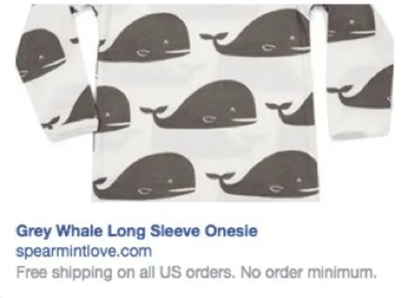 Grey whale patterned long sleeve onesie for infants.