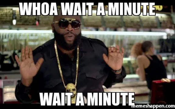 Man in black shirt with hands up and text saying 'Whoa wait a minute'