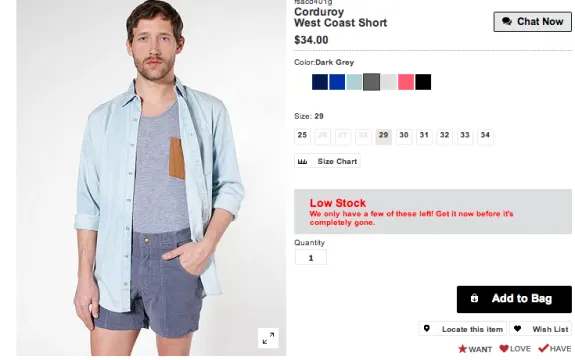 Man wearing light blue shirt and dark grey corduroy shorts with price details.