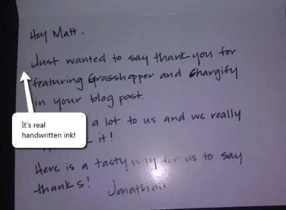 Handwritten thank you note on dark background with an arrow pointing to text.