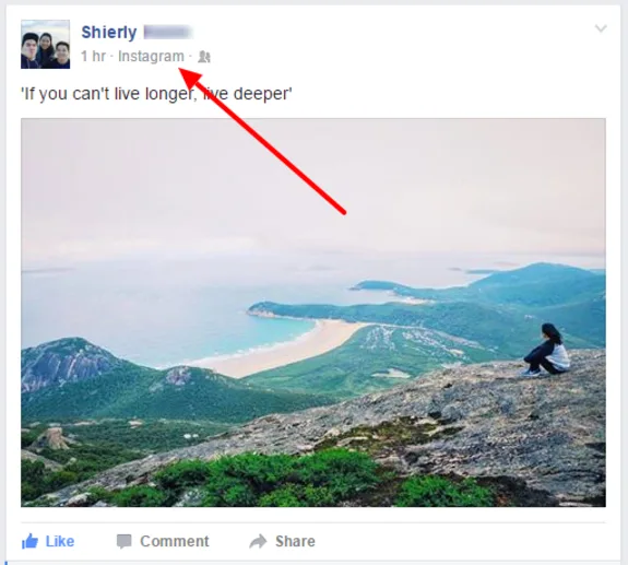 Person sitting on rock overlooking scenic coastal view with mountains and ocean