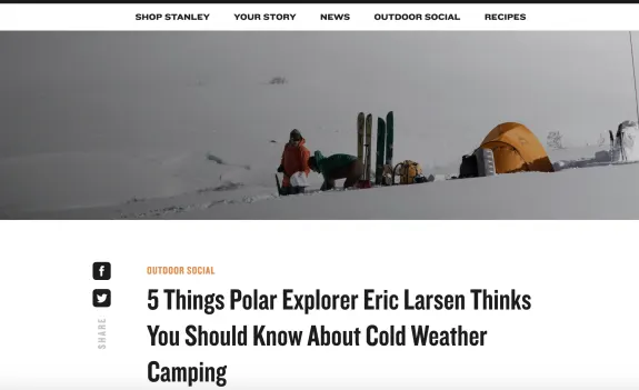 Polar explorer setting up camp in snowy landscape with tents and gear
