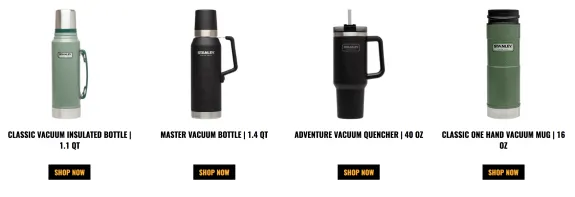 Four Stanley vacuum bottles and mugs in various sizes and colors on display.