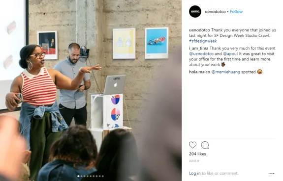 Woman presenting at SF Design Week Studio Crawl with audience and laptop