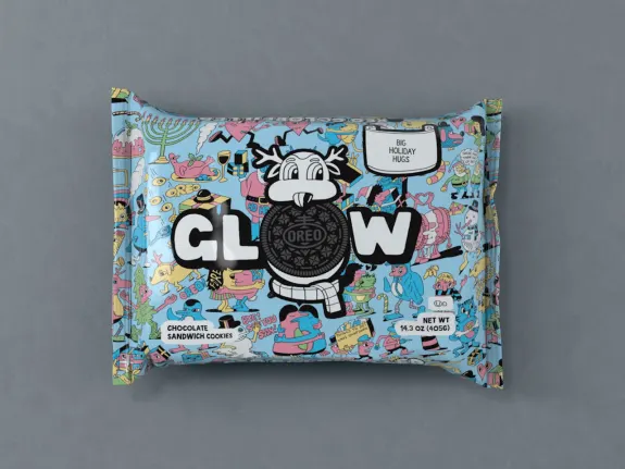Oreo Glow holiday packaging with colorful design on gray background.