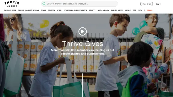 Children participating in Thrive Market charity event with gift bags.