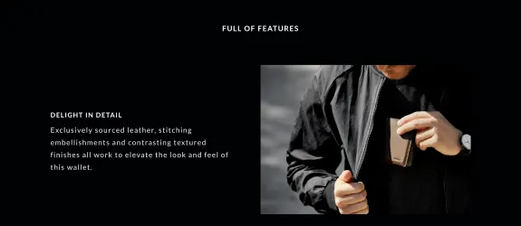 Man holding brown leather wallet inside black jacket