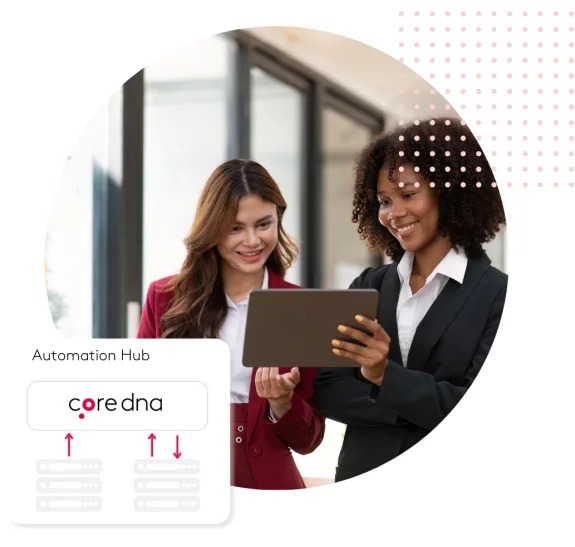 Two business women collaborating on a tablet at an automation hub.