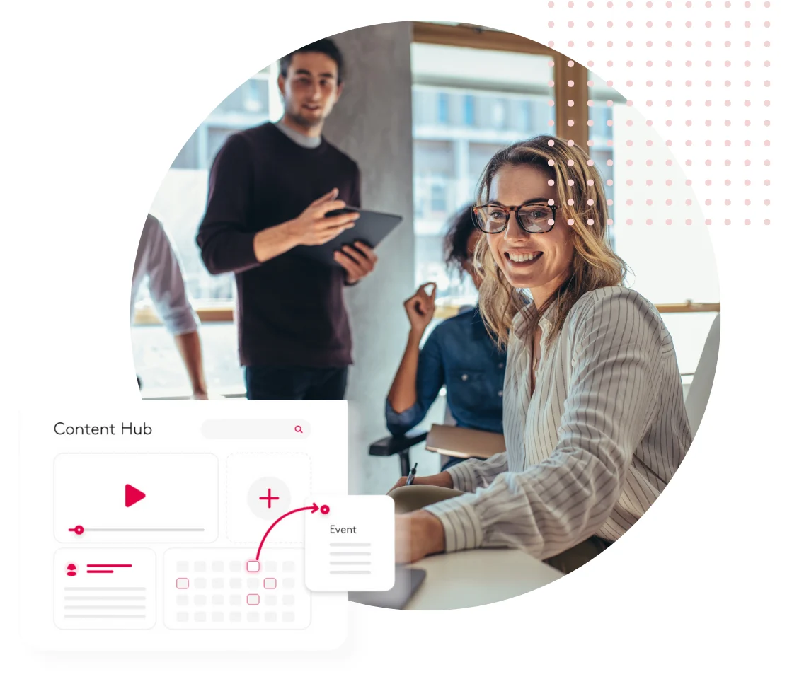 Team collaborating in an office with a digital content hub interface displayed.