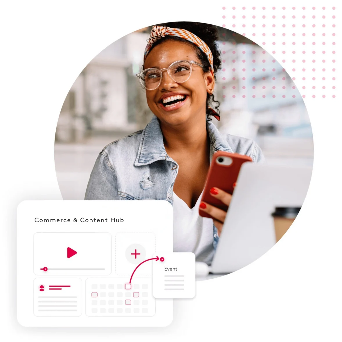 Smiling woman holding phone, working on content hub on laptop.