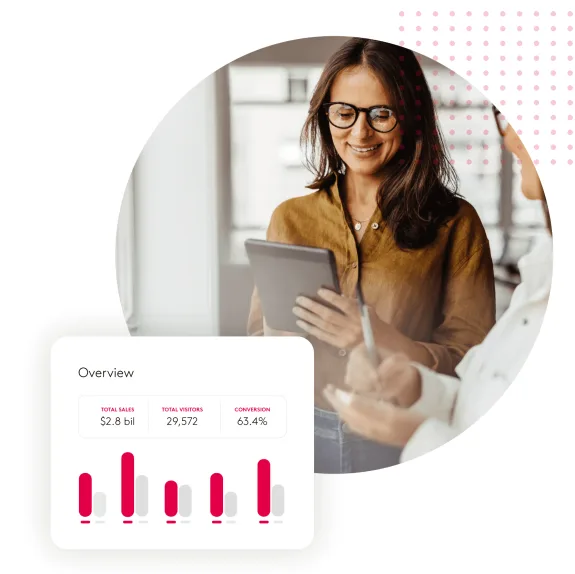 Businesswoman reviewing sales data on tablet with charts and graphs.